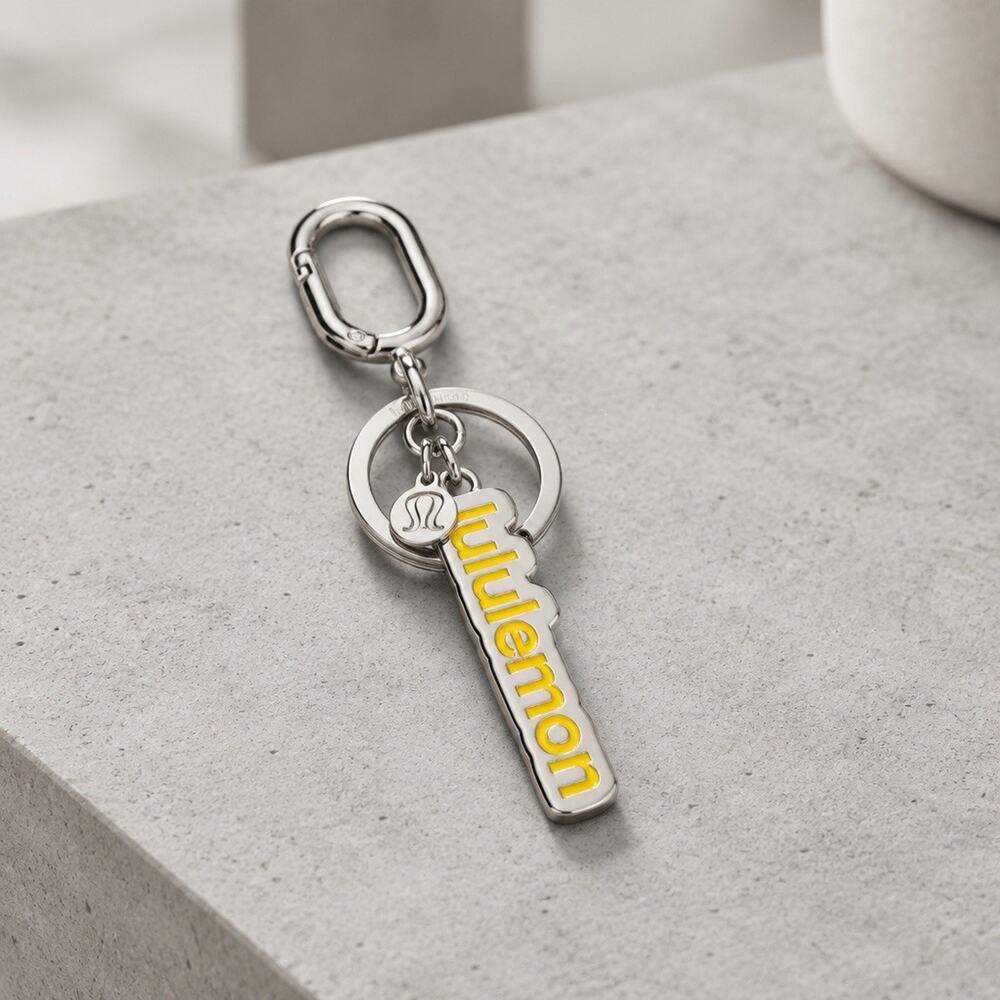 NWT Lululemon Spellout & Logo Heavy Metal Keychain Bag Charm Silver & Yellow
